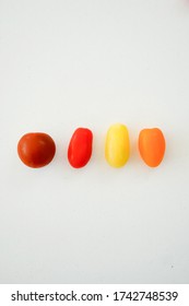 Multi Colored Organic Tomatoes On A Quartz Worktop