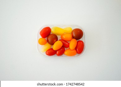 Multi Colored Organic Tomatoes On A Quartz Worktop