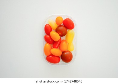 Multi Colored Organic Tomatoes On A Quartz Worktop