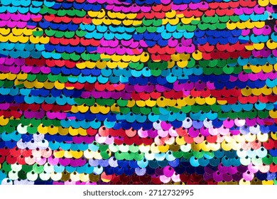 Multi colored sequins textile background texture. Multicolor sequins fabric background.