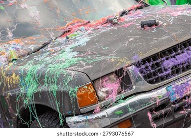 Multi colored silly string on car at Carnival Parade