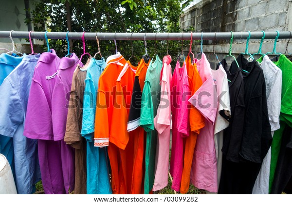 Multi colored Used Shirt with hangers.Dry\
clothes in hangers.