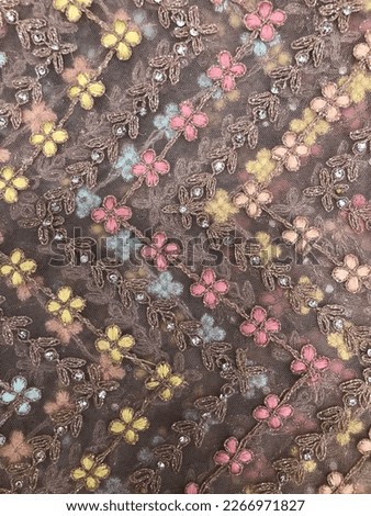 Multi Colour sequins with grey threads flowers type embroidery work on lavender soft net fabric
