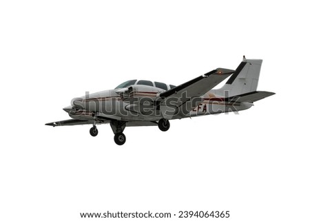 Multi Engine flying aircraft. Isolated general aviation airplane on white background. Retractable landing gear extended, twin engine propeller plane, low wing piston powerplant