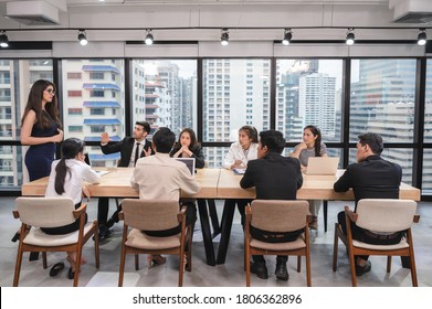 Multi ethnic business team colleague seriously meeting and discussing on conference table in modern office - Shutterstock ID 1806362896