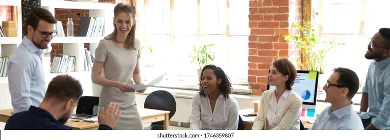 Multi Ethnic Business Team Having Fun At Group Meeting. Participation At Team Building, Employees Laughing At Briefing Or Corporate Training Concept. Horizontal Photo Banner For Website Header Design