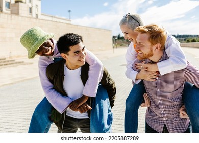 Multi Ethnic Group Of Happy Young People Having Fun Together - Diverse Millennial Student Friends Laughing Outdoors - Friendship And Youth Concept