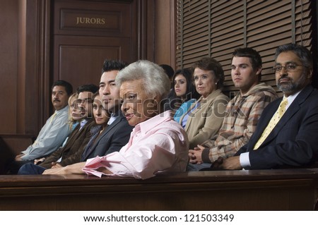 Multi ethnic jurors in witness stand of court house