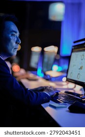 Multi ethnic software developers and data analysts working on complex coding and AI algorithms in a modern tech lab. Collaborative environment for digital innovation.