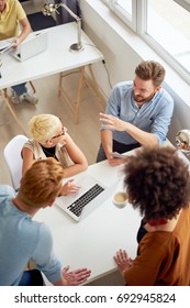 Multi Ethnic Team Having Meeting And Presentation At Modern Office