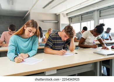 Multi ethnic teenager students taking exam at High School - Technical preparation course for University - Powered by Shutterstock