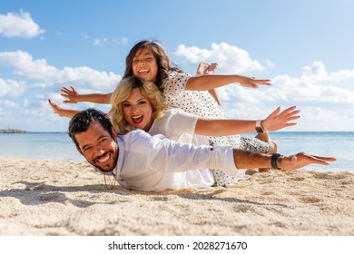 A Multi Etnical Family Playing In The Beach Of Cancun, Mexico