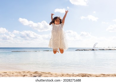 A Multi Etnical Family Playing In The Beach Of Cancun, Mexico