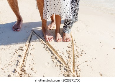 A Multi Etnical Family Playing In The Beach Of Cancun, Mexico