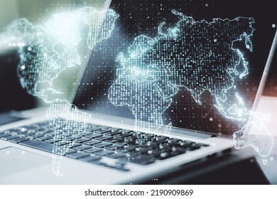 Multi exposure of abstract creative digital world map on modern laptop background, tourism and traveling concept