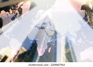 Multi exposure of abstract creative digital world map hologram on modern skyscrapers background, research and analytics concept