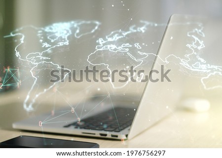 Multi exposure of abstract creative digital world map on modern laptop background, tourism and traveling concept