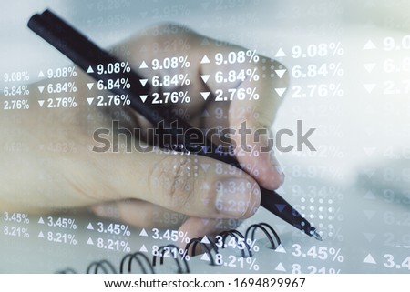 Multi exposure of abstract graphic data spreadsheet sketch with man hand writing in diary on background, analytics and analysis concept