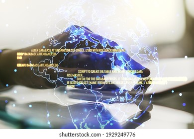Multi exposure of abstract programming language hologram with world map and hand working with a digital tablet on background, artificial intelligence and neural networks concept