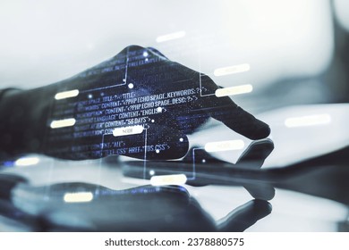 Multi exposure of abstract programming language hologram and hand working with a digital tablet on background, artificial intelligence and machine learning concept