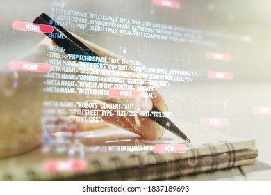 Multi exposure of abstract software development hologram and man hand writing in notebook on background, research and analytics concept