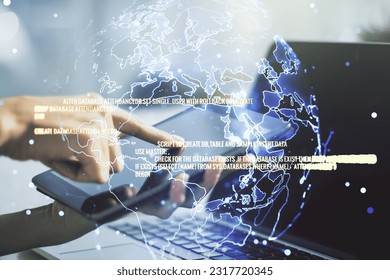 Multi exposure of abstract software development hologram with world map and finger presses on a digital tablet on background, global research and analytics concept