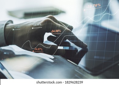 Multi exposure of abstract statistics data hologram interface and hand working with a digital tablet on background, computing and analytics concept