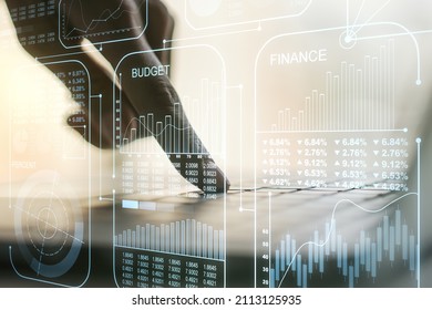 Multi exposure of abstract statistics data hologram interface with hands typing on computer keyboard on background, computing and analytics concept