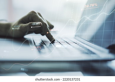 Multi exposure of abstract statistics data hologram interface with hands typing on computer keyboard on background, computing and analytics concept