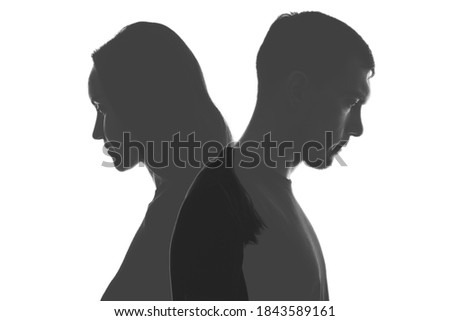 multi exposure black and white silhouettes of portraits men and women on white background. Divorce, relationships concept