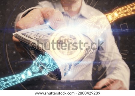Multi exposure of blockchain theme drawing hologram and USA dollars bills and man hands. Business concept.