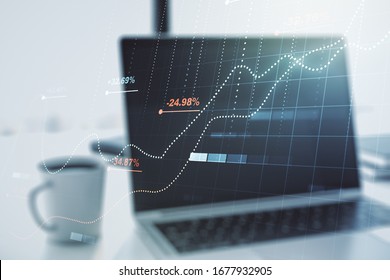 Multi exposure of creative statistics data hologram on laptop background, stats and analytics concept