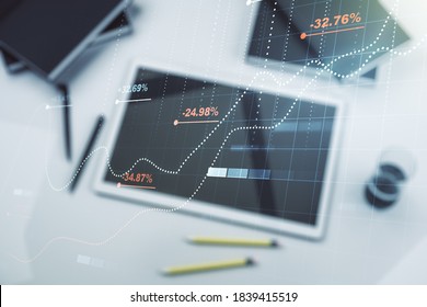 Multi exposure of creative statistics data hologram and digital tablet on background, top view, stats and analytics concept