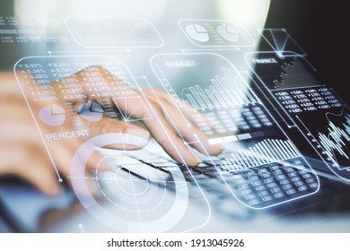 Multi exposure of creative statistics data hologram with hands typing on computer keyboard on background, stats and analytics concept