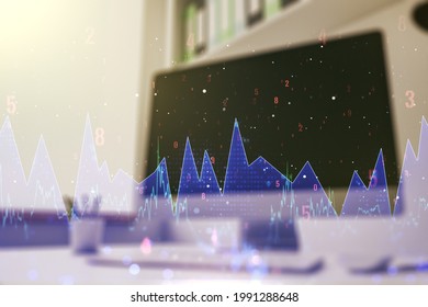 Multi exposure of creative statistics data hologram and modern desktop with laptop on background, stats and analytics concept