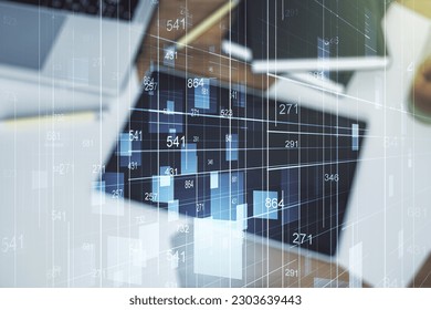 Multi exposure of creative statistics data hologram and digital tablet on background, top view, stats and analytics concept