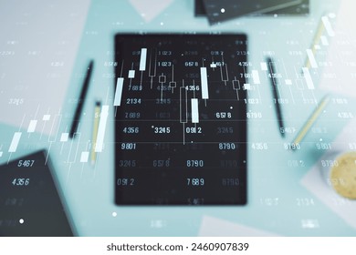 Multi exposure of creative statistics data hologram and digital tablet on background, top view, stats and analytics concept