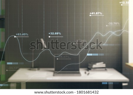Multi exposure of creative statistics data hologram and modern desktop with laptop on background, stats and analytics concept