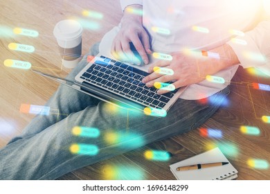 Multi exposure of data internet theme hologram with man working on computer on background. Concept of innovation.