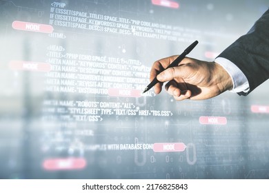 Multi exposure of developer hand with pen working with abstract programming language hologram on blurred office background, artificial intelligence and machine learning concept