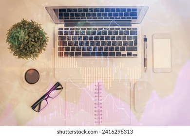 Multi exposure of forex chart drawing over table background with computer. Concept of financial research and analysis. Top view.