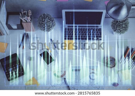 Multi exposure of forex chart drawing over table background with computer. Concept of financial research and analysis. Top view.