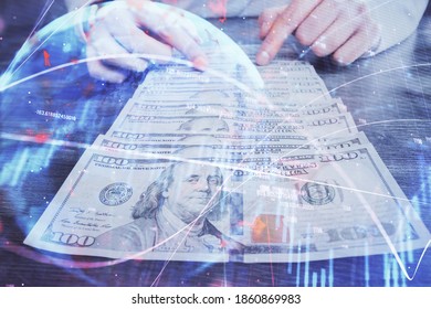 Multi exposure of forex graph drawing hologram and USA dollars bills and man hands. Technical Analysis concept.
