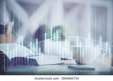 Multi exposure of forex graph drawing and desktop with coffee and items on table background. Concept of financial market trading