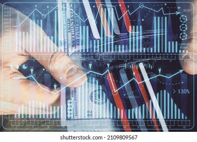 Multi exposure of forex graph drawing hologram and USA dollars bills and man hands. Technical Analysis concept.