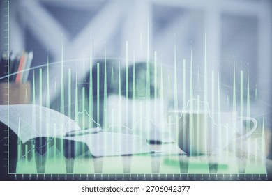 Multi exposure of forex graph drawing and desktop with coffee and items on table background. Concept of financial market trading