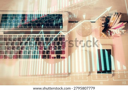 Multi exposure of forex graph drawing over desktop background with computer. Concept of financial analysis. Top view.
