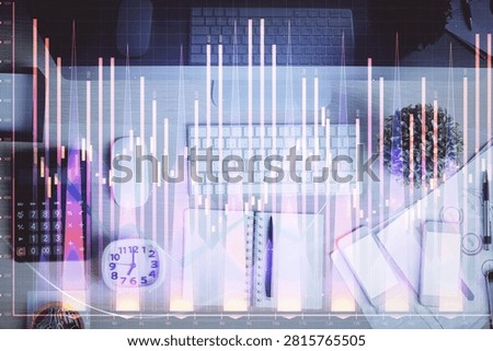 Multi exposure of forex graph drawing over desktop background with computer. Concept of financial analysis. Top view.
