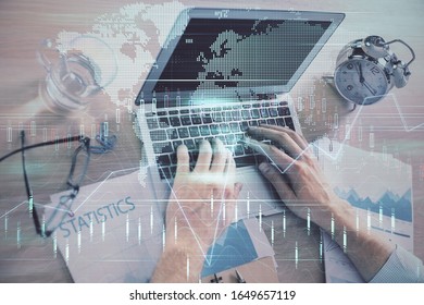 Multi exposure of forex graph with man working on computer on background. Concept of market analysis.