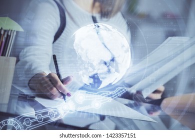 Multi exposure of hands making notes with world map hologram and data theme icons. Concept of global data.
